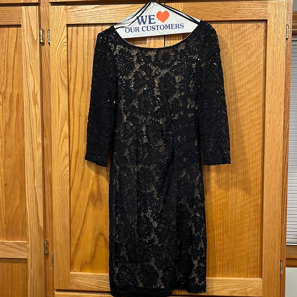 Lace three quarter length sleeve knee length dress